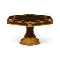 a wooden table with an intricate design on the top and sides, inlaid to wood