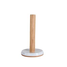 a wooden stick on top of a white base with a wood handle and two round bases