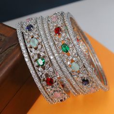 Indian Silver Tone American diamond Ruby Red & Zircon Bangles Bracelet Set Bollywood Ethnic Wedding Costume Jewelry, Green Bangle Set, Round Personalized Bangle set Emerald Green Zircon Bangles Buy with confidence, Enjoy your Free Gift With every purchase. Thank you!! BUYER FEEDBACK * Do remember to give us 5 star rating if you are satisfied with our product & service * If you have any queries about the product/service expect a reply within 48 hrs. * Please do not leave negative and neutral feed Ethnic Wedding, Bangle Bracelet Set, Bangles Indian, Wedding Costumes, American Diamond, Bangle Set, Multi Stone, Bracelet Set, Costume Jewelry