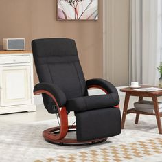 a black recliner chair sitting in a living room