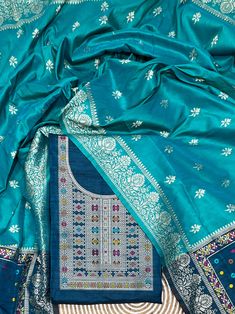 Product Details Teal Blue Unstitched Salwar Suit in kalamkari Raw Silk Elevated with Kalamkari Thread Woven Work Accompanied by an Unstitched Kurta, Bottom and Dupatta with Tassels Comes with the Vishnu Weaves Promise of Premium Quality Size & Fit Kurta & Bottom : 5.20 Mtrs Dupatta : 2.40 Mtrs Material & Care Dry Wash Only