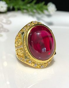 Vintage 15K 610 Yellow Gold Ruby Cabochon & White Topaz Ring ...Marked 610 and tested 15K Gold...Total of weights 18.1grams...Size 8.25...Measure of Face 27.7MM...It's in very good condition. Formal Gold Cabochon Gemstones, Gold Cabochon Gemstones For Formal Occasions, Gold Oval Cabochon Gemstones For Anniversary, Gold Cabochon Gemstones For Anniversary, Gold Cabochon Gemstones For Wedding, Gold Polished Cabochons For Anniversary, Heirloom Gold Round Gemstones, Collectible Gold Ruby Rings, Gold Signet Ring With Stone Setting For Anniversary