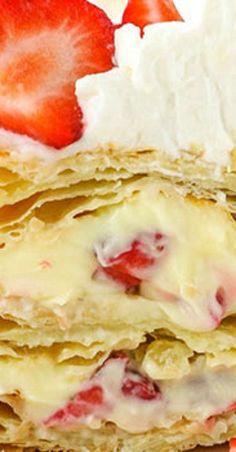 a stack of crepes with strawberries on top