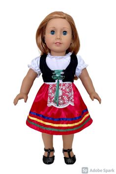 an american girl doll wearing a red and blue dress