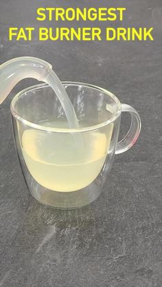 a pitcher filled with liquid sitting on top of a table