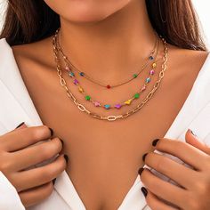 Description:Chic Layered Colorful Enamel Heart Chain Choker Necklace Set Specification:Size: 13.8" - 17.7"Weight: 0.62 oz/setMaterial: Copper. EnamelStyle: Bohemia Features & Details:This layering enamel heart chain choker necklace set is lead-free. nickel-free. cadmium-free and hypoallergenic. Don't worry about allergies to the sensitive skin or discomfort to your health. which you could wear it with confidence for a long time.This necklace set for woman is decorated with retro design and superb craftsmanship to create special piece that can satisfy any jewellery lovers. making you more attractive and charming.It is easy to match your different outfits and also suitable for any occasions like wedding. banquet. costume party. engaged party. prom. anniversary. holiday. evening party or othe Multicolor Metal Charm Necklace With Adjustable Chain, Trendy Multicolor Heart Necklace, Multicolor Metal Chain Necklace As A Gift, Multicolor Heart Beaded Necklaces, Multicolor Metal Chain Necklace For Gifts, Trendy Multicolor Jewelry With Heart Charm, Heart-shaped Multicolor Metal Jewelry, Multicolor Heart-shaped Metal Jewelry, Multicolor Heart Shaped Metal Jewelry