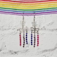 These unique beaded chandelier earrings show your bisexual pride. These earrings are made with colorful glass beads that look amazing in the sunlight. These cute earrings are great for any occasion or gift. The bead colors featured are as follows: magenta, purple, and dark blue. The ear wire is made from nickel-free material, and these earrings can be customized for more sensitive ears. Please put a note in the order and I can change the ear wire to stainless steel which is hypoallergenic and sa Omnisexual Earrings, Bisexual Earrings, Trans Flag Earrings, Bisexual Jewelry, Lgbtq Earrings, Iridescent Butterfly, Beaded Chandelier Earrings, Magenta Purple, Pride Colors