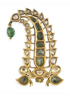 A DIAMOND AND EMERALD-SET GOLD TURBAN ORNAMENT (SARPECH) NORTH INDIA OR DECCAN, 19TH CENTURY In the shape of a rising palmette curving at top towards the left, a floral bud and petals at its base, an emerald pendant hanging at top, the reverse enamelled with red flowers and green leaves on white ground, a crane with its head turning backward decorating the base of the palmette, the sides enamelled, some flaking Indian Royalty, Emerald Set, Ancient Jewellery, India Jewelry