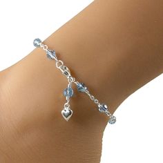 This lovely anklet is the perfect something blue for the bride on her special day. Made with aquamarine AB Swarovski crystals and pretty sterling silver chain, with a dangling sterling silver heart charm. Please choose the size that you need from the drop down menu, bearing in mind that the anklet should be approximately one inch larger than the size of your ankle. The anklet will arrive in an attractive gift box. Pink Anklet, Purple Anklet, Blue Anklet, Bridal Anklet, Wedding Anklets, Silver Ankle Bracelet, Something Blue Bridal, Gelang Manik-manik, Crystal Anklet