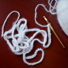 a crochet hook and yarn on a table