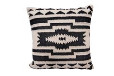 a black and white pillow with geometric designs on the front, sitting on a white background