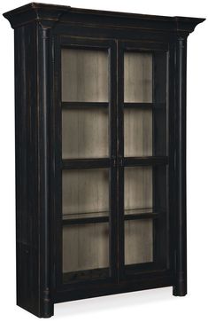 an old black bookcase with glass doors