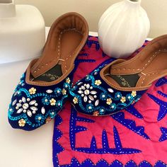 "--- FREE SHIPPING on each additional pairs when you pay for your first pair of shoes --- * Azure base with may blue sequins swirls, imitation pearls and reflective flat teardrop beads embellishment on flat shoes. * Cushioned Insole. * Leather out sole. * Easy and comfortable to wear. * Perfect for every occasion. * Formal wedding flats. * Best in quality. * Handmade. Please choose your size from the below chart. If you are not sure about your size, please let us know. We'll help you out. Sizes: Blue Closed Toe Flats For Formal Occasions, Blue Closed Toe Wedding Shoes, Blue Closed Toe Flats For Party, Elegant Blue Flats For Party, Blue Flat Heel Wedding Shoes, Blue Flat Wedding Shoes, Elegant Blue Party Flats, Festive Meenakari Round Toe Flats, Blue Punjabi Jutti