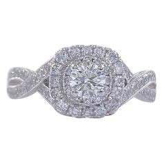 Neil Lane Bridal Style: Double Halo & Twisted Band Engagement Ring SKU Number: #940447410 Metal: 14K White Gold Size: 5.25 sizable Total Carat Weight: 7/8 TCW / 0.87 tcw Center Diamond Shape: Round Brilliant Diamond 0.33CTS Accent Diamonds: Round Diamonds 66 Stones 0.54 TCW Diamond Color & Clarity: I / I1 Hallmark: "Neil Lane" signature "14kt " Includes: -Certified Appraisal -Elegant Ring Box Retail Value: $2,499.99 SKU#11500TSD070921