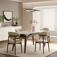 a dining room table and chairs with white rug