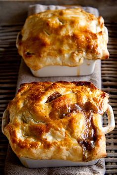 two square casseroles sitting on top of a table