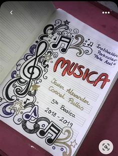 an open music book with musical notes on it