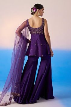 Purple peplum kurta with thread embroidered floral patterns, embellished by sequins and crystals. Comes with sharara and dupatta. - Aza Fashions Purple Palazzo Set With Dori Work For Wedding, Purple Sleeveless Wedding Set, Purple Silk Sharara With Sheer Dupatta, Purple Sleeveless Festive Sets, Fitted Purple Palazzo Set With Zari Work, Fitted Purple Silk Sharara, Purple Fitted Sharara With Sheer Dupatta, Fitted Purple Sharara With Sheer Dupatta, Kurta Sharara Set