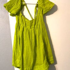 Olive Silk Dress The Brand Is Free People. The Dress Has Great Material And Quality Casual Green Dress For Beach Cover-up, Green V-neck Sundress For Beach, Green A-line Mini Dress For Day Out, Green Sleeveless Mini Dress For Beach Cover-up, Vacation A-line Mini Dress With Tie Back, Chic Green Cotton Sundress, Green Short Sleeve Mini Dress For Vacation, Green Sundress For Beach, Green Tie-back Mini Dress For Beach