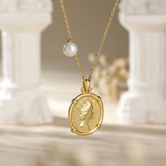 Carry a little history with our beloved Queen Elizabeth II Portrait Coin Pendant Necklace. This unique and modern designed sterling silver necklace is versatile and reversible to suit every occasion. It has a Queen Elizabeth portrait on one side, and the "Saint George Killing the Dragon" on the other. It is easy to coordinate with your outfits and other jewelry without having to overthink it. Just put it on and you are good to go!Carat Weight: 1.5 ctStone Shape: RoundStone Size: 6 mmNumber of St Elegant Silver Coin Necklace For Anniversary, Elegant Sterling Silver Coin Necklace With Round Pendant, Elegant Sterling Silver Medallion Coin Necklace, Elegant Sterling Silver Pendant Coin Necklace, Luxury Silver Coin Necklace Tarnish Resistant, Elegant Sterling Silver Coin Pendant Necklace, Luxury Silver Tarnish Resistant Coin Necklace, Luxury Silver Tarnish-resistant Coin Necklace, Elegant Sterling Silver Medallion Necklace With Coin Pendant