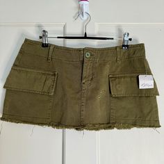 Free People - We The Free Cargo Micro Mini Skirt Condition: New With Tags, Price Has Been Cut Off (Originally $88) Color: Olive Green/ Military Green Size: 6 Measurements: Waist: 16 In. Length: 10 In. Details: Two Side Pockets Low Rise Distressed Hem Khaki-Like Material Soft! Strapless Denim Dress, Olive Skirt, White Denim Skirt, Micro Mini Skirt, Jean Mini Skirts, Denim Skirt Women, Tie Front Cardigan, Micro Mini, Free People Denim