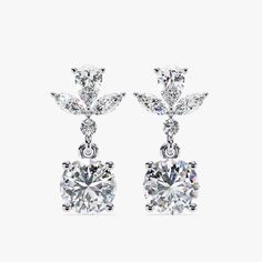 Introducing our exquisite 1.15 CT Dangle Stud Lab Grown Diamond Earrings, a perfect blend of sophistication and modern style. These earrings feature a stunning arrangement of marquise and round-cut diamonds, meticulously set to dangle gracefully. Crafted in luxurious 14k gold with a secure pushback closure, these dangle drop earrings offer both elegance and comfort. Ideal as a dazzling birthday gift or a special treat for her, these earrings are designed to captivate and charm, making every mome Classic Brilliant Cut Chandelier Earrings For Anniversary, Classic White Gold Chandelier Earrings With Diamond Cut, Classic Marquise White Gold Bridal Earrings, Elegant Marquise Diamond Cut Cluster Earrings, Fine Jewelry Marquise Bridal Earrings For Formal Occasions, Formal Marquise Bridal Earrings In Fine Jewelry Style, Formal Marquise Bridal Earrings Fine Jewelry, Fine Jewelry Bridal Drop Earrings, Classic Cubic Zirconia Chandelier Earrings For Anniversary