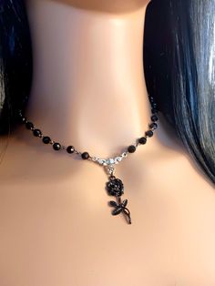 Gothic style Black Rose beaded chain necklace choker. Crafted with meticulous attention to detail, this choker features an intricate and elegant design that exudes both charm and darkness. The black finish adds a touch of sophistication, while the gothic-inspired motifs lend an air of mystique to your ensemble. The most unique jewelry you can find, perfect gift for you and your loved one. We also can add a gift message with your purchase! Just drop us a message or add a note when you check out. Spring Goth Necklace, Elegant Rose Design Choker Jewelry, Elegant Rose Design Jewelry Choker, Rose Design Choker Necklace, Party Choker Necklace With Rose Design, Elegant Black Jewelry With Rose Design, Adjustable Rose Design Choker Necklace, Black Rose Design Party Jewelry, Black Necklace With Rose Design As Gift