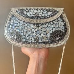 Step Out In Timeless Elegance With Our Handcrafted Mosaic Mother-Of-Pearl Evening Clutch. Each Piece Of Shimmering Mother-Of-Pearl Has Been Carefully Arranged To Create A Stunning Mosaic That Catches The Light With Every Movement, Ensuring You'll Be The Center Of Attention. Chic Handmade Silver Bag, Chic Silver Handmade Bags, Handmade Silver Shoulder Bag, Handmade Silver Shoulder Bag As Gift, Silver Clutch For Fashion Accessory, Silver Clutch As Fashion Accessory, Center Of Attention, Designer Clutch, Evening Clutch