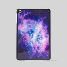 an ipad case with the image of a star cluster in purple and blue, on a gray background