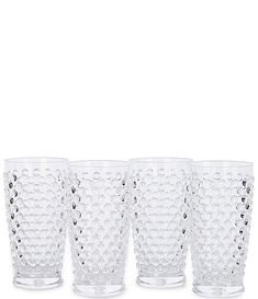 four clear glass tumblers with holes on the bottom and one filled with water droplets