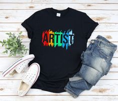 "* All shirts are unisex. * Product measurements may vary by up to 2 inches. * All Designs are originally made by myself or my team.  Painter shirt with the quote \"Artist\" is a fun gift for men and women!  To see more designs of your topic Painter you can search & find them in the store:   https://www.etsy.com/shop/Retailorie  You find there also an announcement if the shipping & production times change :) painter shirt,painting shirt,paint shirt,artist shirt,art shirt,gifts for painters,artist gifts,painter t shirt,drawing shirt,gifts for art lovers,art teacher shirt," Gifts For Painters, Painting Shirts, Painting Thoughts, Cricut Corner, Art Teacher Outfits, Students Gifts, Gifts For Artists, Paint Shirt, Shirt Painting