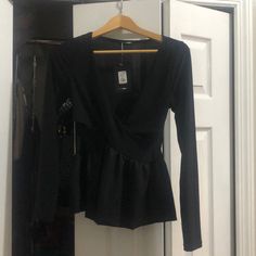 Super Cute Black Peplum Style Sexy Low Cut Blouse. Perfect With Jeans Or Slacks. Brand New With Tags. Size Medium. Stretch V-neck Blouse For Party, Fitted V-neck Top For Night Out, V-neck Blouse For Going Out In Fall, Black V-neck Top For Night Out, Fitted V-neck Party Blouse, Fitted V-neck Evening Blouse, Chic V-neck Peplum Top For Party, Trendy V-neck Blouse For Party, Chic Fitted Peplum Top For Party