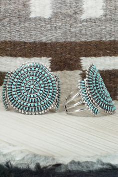 This Kingman turquoise and sterling silver necklace, earrings, bracelets, and rings set was made by Zuni silversmith Merlinda Chavez. The back of the necklace is signed D & M Chavez and Zuni.Necklace: 30"Length: 3 1/2"Width: 2 1/2"Earrings:Length: 1 3/4"Width: 1 3/4"Bracelets:Size: 5 3/4" (will fit up to a 7 1/8" wrist)Gap: 1 3/8"Length: 2 5/8"Rings:Size: 9.25 & 9.5Length: 1 3/4"Width: 1 3/4"Free shipping on all orders! We ship with USPS and always include tracking. All orders ship within a day Artisan Turquoise Jewelry With Polished Finish, Southwestern Style Jewelry Bracelet With Inlay, Southwestern Style Bracelet With Inlay, Unique Turquoise Jewelry With Polished Finish, Turquoise Bracelet Jewelry Collectible, Bohemian Jewelry With Polished Finish For Collectors, Southwestern Inlay Bracelet, Turquoise Round Jewelry With Sterling Silver Clasp, Turquoise Jewelry With Sterling Silver Clasp