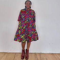 The Confetti dress. Our loose fit colourful dresses made out of non-stretchy African print are perfect for you in case you are looking for a style idea that is versatile, comfortable, and looks fabulous year-round. All materials used to design the dresses are sourced in Kenya.  MEASUREMENT GUIDE:  We recommend asking questions about sizes or you can take your own measurements (at the bust) if unsafe. Since its an A- Line, you only need to ensure that you have the right fit for the bust. Please s Casual Multicolor Short Sleeve Shirt Dress, Casual Multicolor Midi Dress With Pockets, Casual Short Sleeve Midi Dress With Vibrant Print, Casual Midi Dress With Vibrant Print, Casual Multicolor Midi Dress For Dress Down, Multicolor Casual Dresses For Work, Casual Multicolor Midi Dress For Dress Down Occasions, Casual Multicolor Dresses For Work, Casual Multicolor Dress For Work