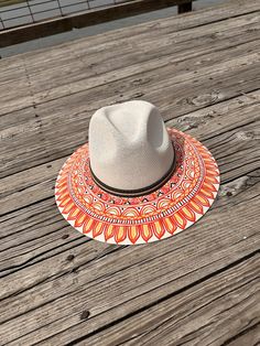 Don't miss your opportunity to own this one of a kind hand painted hat. The detailing is impressive. Perfect for a day at the beach, a sporting good outing or everyday use. Perfect for adding an extra special touch to your outfit. Size is Large Adjustable Orange Straw Hat With Curved Brim, Orange Fedora Hat For Beach, Orange Fedora Hat For The Beach, Adjustable Wide Brim Orange Sun Hat, Orange Fedora For Beach, White Fedora For Festivals, One Size Fits Most, Orange Adjustable Wide Brim Sun Hat, Adjustable Orange Wide Brim Sun Hat, White Fedora For Festivals