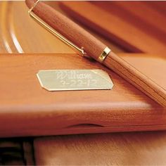 a pen sitting on top of a wooden desk