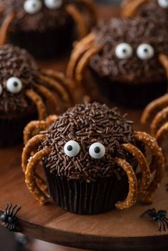 chocolate cupcakes decorated with googly eyes and spider decorations