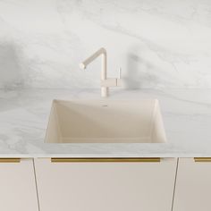 a white sink sitting under a faucet on top of a marble countertop