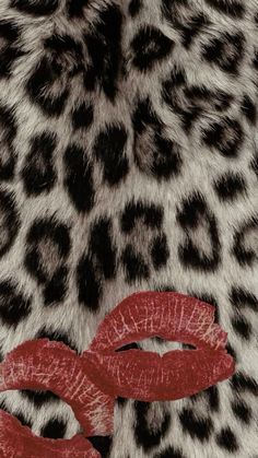 a leopard print with red lipstick on it's lips