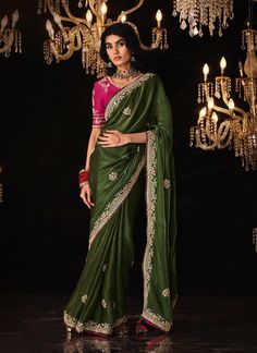 Take risks and stand out with our Premium Green Pure Fabric Saree. Embellished with stunning sequin stone embroidery and attached with fancy tassels on the pallu, this saree is perfect for wedding wear. It's sure to make you look and feel confident, bold, and adventurous! The unstitched blouse can be customized upto 44 inches. Do Note: All the accessories shown are for styling purpose only. Slight color variation may occur due to photographic reasons. Fall and Pico : Done Draping Saree(Ready to Traditional Silk Saree, Green Saree, Madhuri Dixit, Art Silk Sarees, Embroidered Wedding, Silk Sarees Online, Fancy Sarees, Soft Silk Sarees, Bollywood Saree