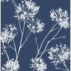 a blue and white wallpaper with flowers on it