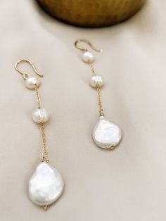 These are perfect for wear every day, with our 3 Pearl dangle earrings you are elegant with them. Is fashionable at any time. If you like simple, classy, and Unique jewelry, these earrings are perfect for you. They make elegant, versatile earrings. Details: - material: 14k gold-filled 14k rose gold-filled sterling silver - measure: 3 inches - Gems: freshwater round pearl and coin pearl (free-form) ADDITIONAL INFORMATION These earrings have been created by hand so no two pieces are identical. Eac Handmade Silver Jewellery, Pearl Dangle Earrings, Coin Pearls, Pearl Earrings Dangle, Silver Jewellery, Handmade Silver, Two Pieces, Sterling Silver Earrings, Aurora