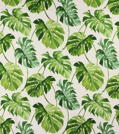 a green and white wallpaper with lots of leaves on it's surface,