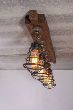 an old fashioned light fixture hanging from the ceiling