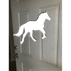 a screen door with a white horse on it