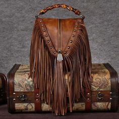 Buy Brown Leather Fringe Bag Shoulder Vintage Handbags with Bamboo Handle Worldwide Free shipping and return, color: Brown , material: Genuine Leather Black Leather Fringe Bag, Leather Fringe Bag, Fringe Handbags, Lv Bags, Fringe Bags, Boho Bags, Boho Leather, Leather Satchel Bag, Leather Handbags Crossbody