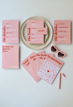 pink wedding stationery with matching sunglasses, napkins and stickers for the bride