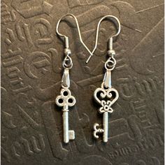 @Pixielife Hand Crafted Stainless Steel Hypoallergenic Earrings And Tibetan Silver Floral Keys For Pierced Ears Other Fun Matching And Mismatched Pairings Lengths Between 1 1/4” To 2” Length Available In This Closet (Make Your Own Matches) Owls 1 1/2” Long Lock & Key. 1 1/4” Long Heart & Crown Celtic Keys Floral Keys Musical Staff 2” Long Star & Starfish Pixie & Pony Lucky Elephant & 4 Leaf Clover Butterflies Are On Sterling Silver Only Someone Really Paying Attention Will Notice The Whimsical N Silver Symbolic Hypoallergenic Earrings, Silver Hypoallergenic Symbolic Earrings, Antique Silver Earrings For Gift, Rainbow Braids, Whimsical Nature, Grape Earrings, Flower Earrings Gold, Heart Crown, Lucky Elephant