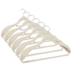 a row of white hangers on a white background