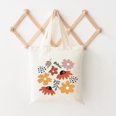 Looking for a cute tote bag to carry all your essentials this summer? This cute Abstract Flowers bag will be perfect to add to your collection. Perfect for a day at the beach or every day life! Playful White Summer Bag, Playful White Bags For Spring, Cute White Bag For The Beach, Cute White Beach Bags, Cute Spring Travel Canvas Bag, Fun Spring Tote Bag, Cute Multicolor Canvas Tote Bag, Spring Fun Tote Bag, Cute White Beach Bag For Travel